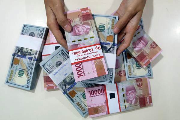 Jumat (11/6) Ini, Rupiah Ditutup Rp 14.189 per dolar AS